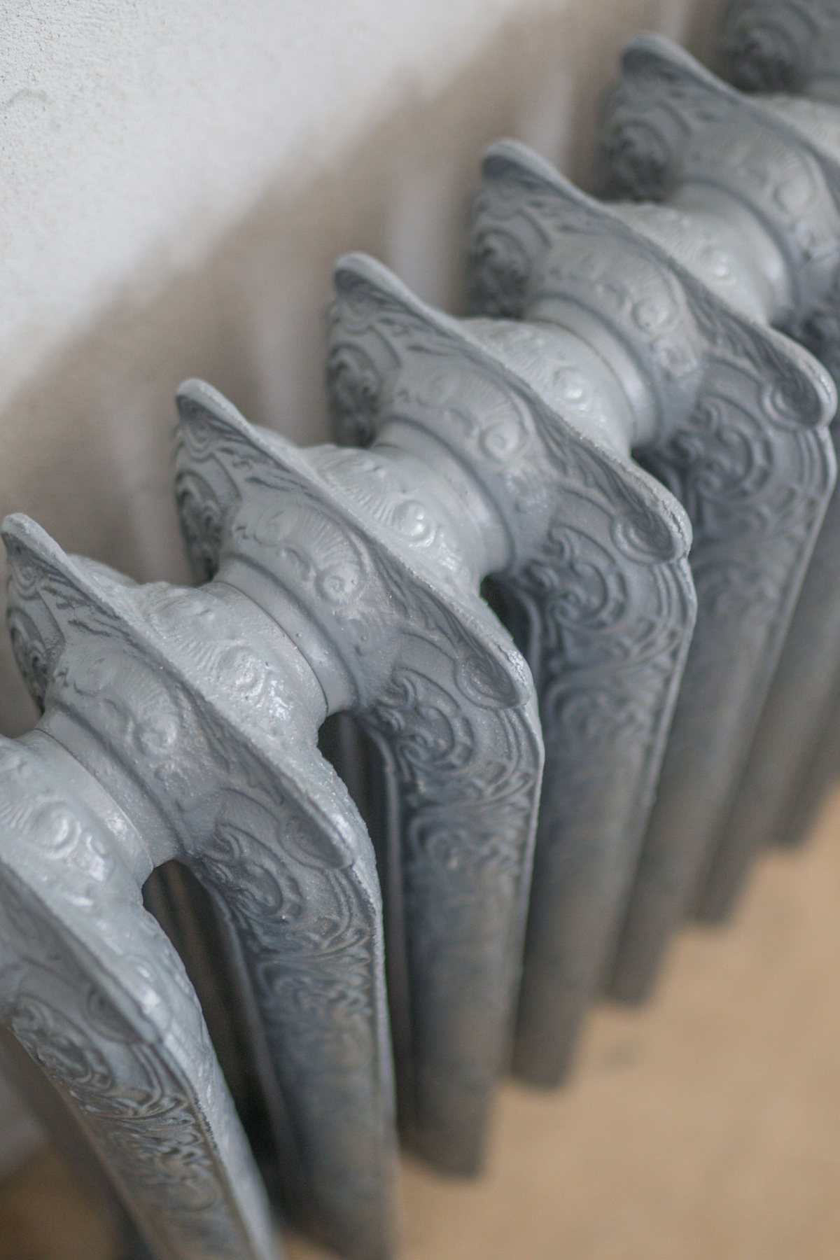 Ornate cast-iron radiator of the kind found in older Bradford homes, where sludge settles in the base