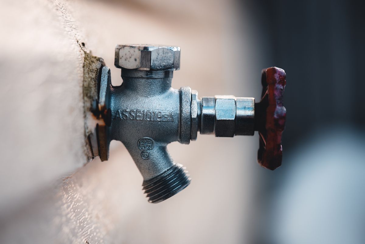 A wheel-handled water valve of the same style as most home stopcocks, turned clockwise to shut off the water